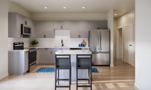 selene tomoka village modern kitchen gray cabinets island barstools stainless steel appliances wood style flooring