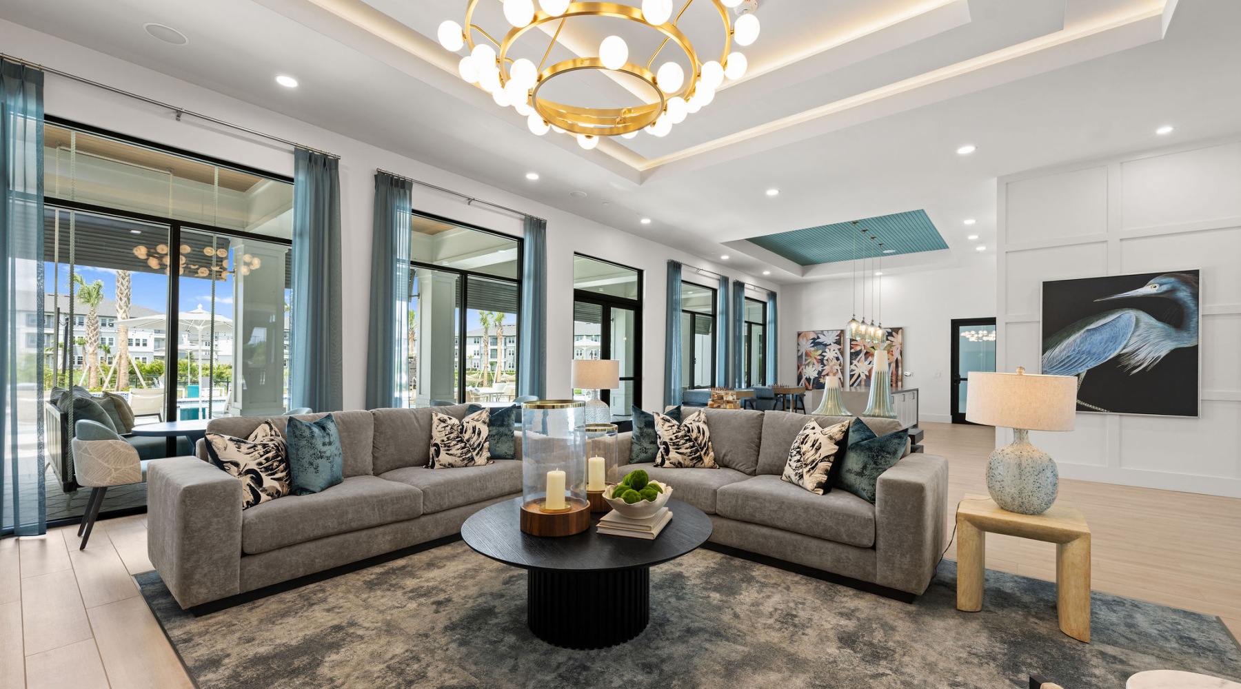 selene tomoka club lounge sofas seating chandelier wall art large windows demo kitchen coffee table