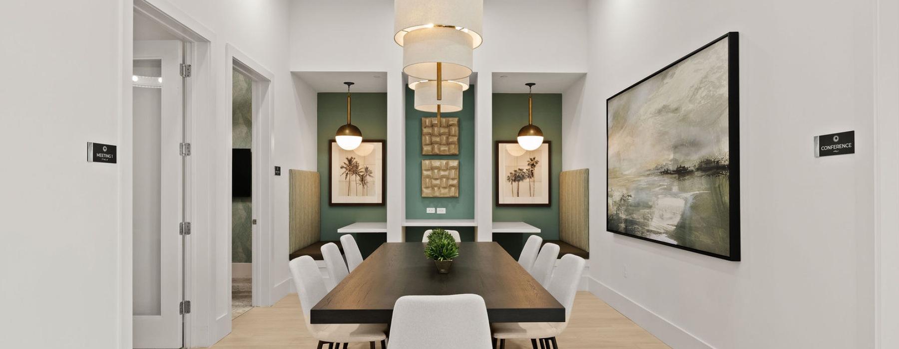 selene tomoka village cowork hub conference table chairs chandelier banquettes wall art offices