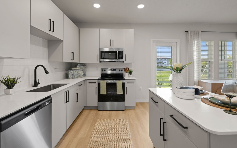 selene tomoka village kitchen island appliances cabinetry rug recessed lighting patio door